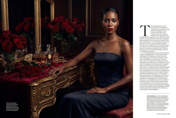 Amara Reign — seated at vanity surrounded by red roses